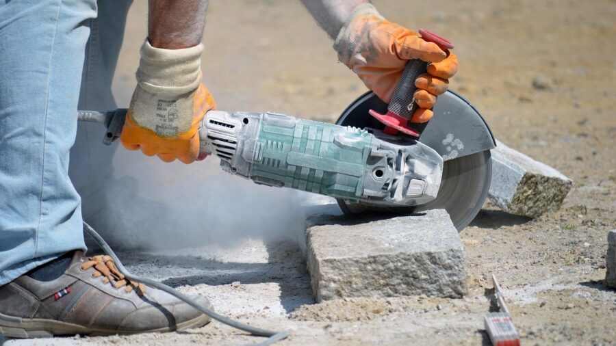 Greenworks PowerAll 24V System Launches with Pro-Grade Power Tool Lineup at Competitive Prices 2 angle grinder cutting metal on job site