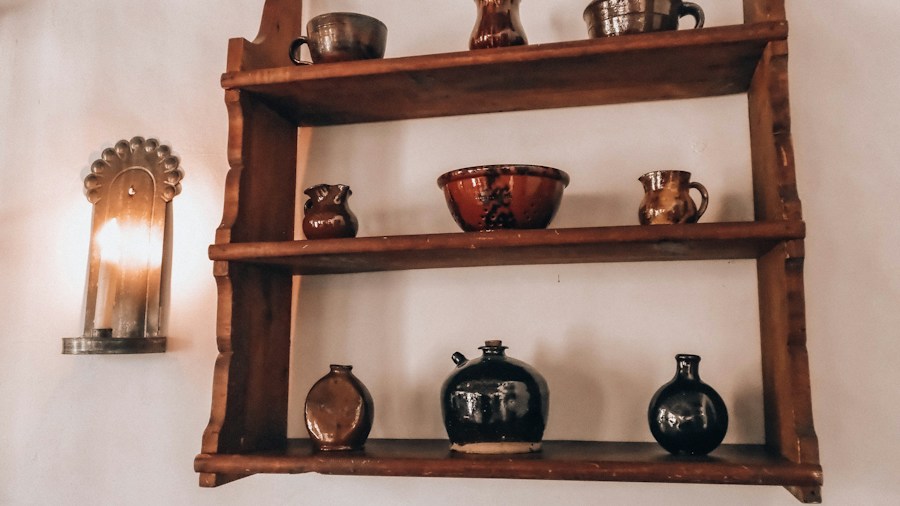 Victorian Fan Vases Return to Interior Design: What Shoppers Should Know 1 antique vases displayed on wooden shelf