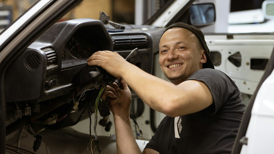 contractor organizing power tools in vehicle