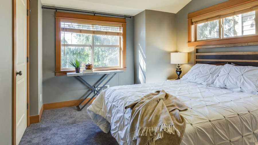 cozy small bedroom with layered window treatments