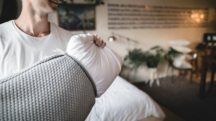 7 Tips for Choosing the Right Pillow for Better Sleep 1 customer testing pillow firmness in store