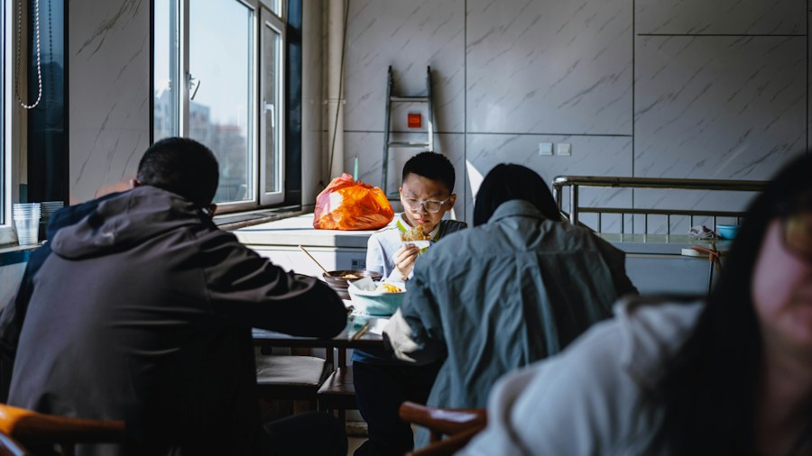 Steelcase Workplace Design Tackles Loneliness Crisis: What Office Shoppers Need to Know 1 diverse workers gathered around table