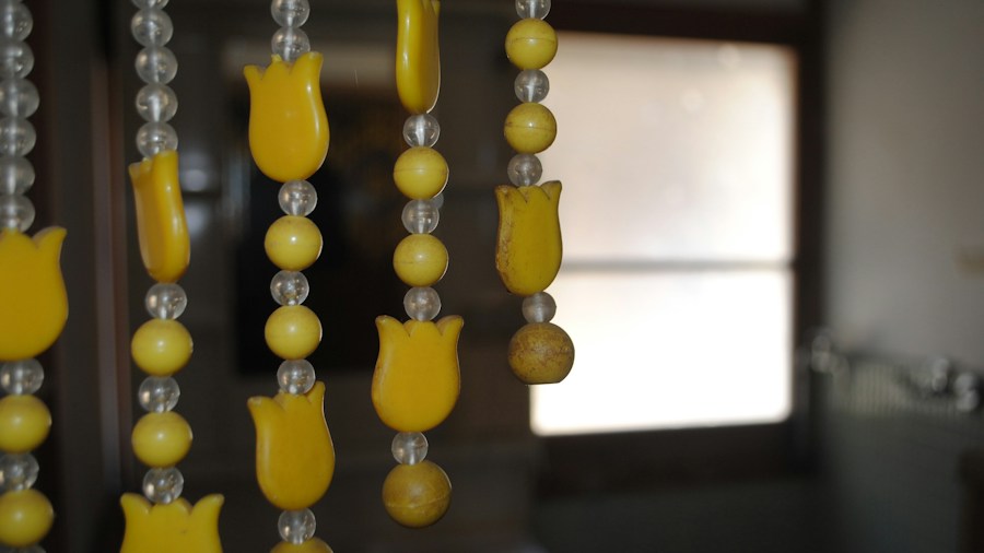 DIY Beaded Curtain Project Transforms Doors and Doorways on a Budget 2 finished beaded curtain hanging