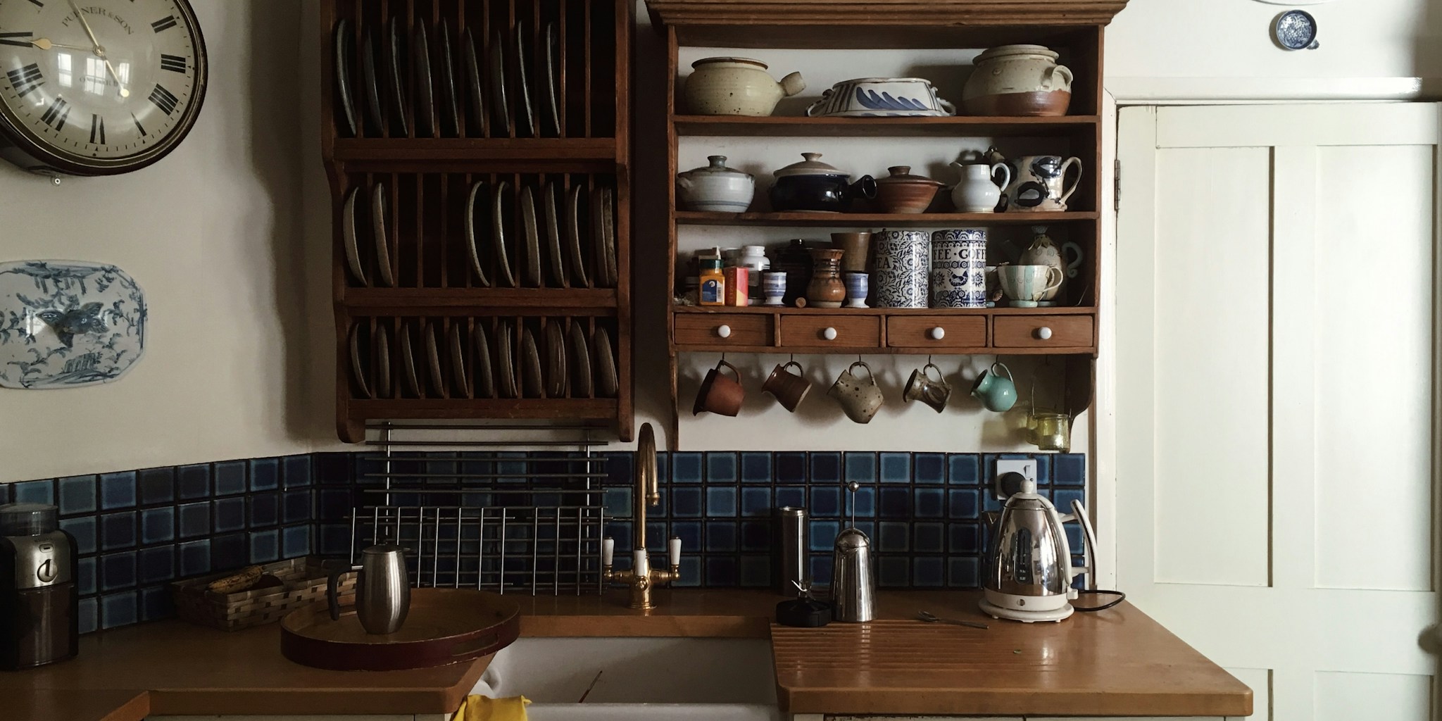 Dark Paint Color Defies the Rules and Makes a Small Kitchen Feel Twice as Big