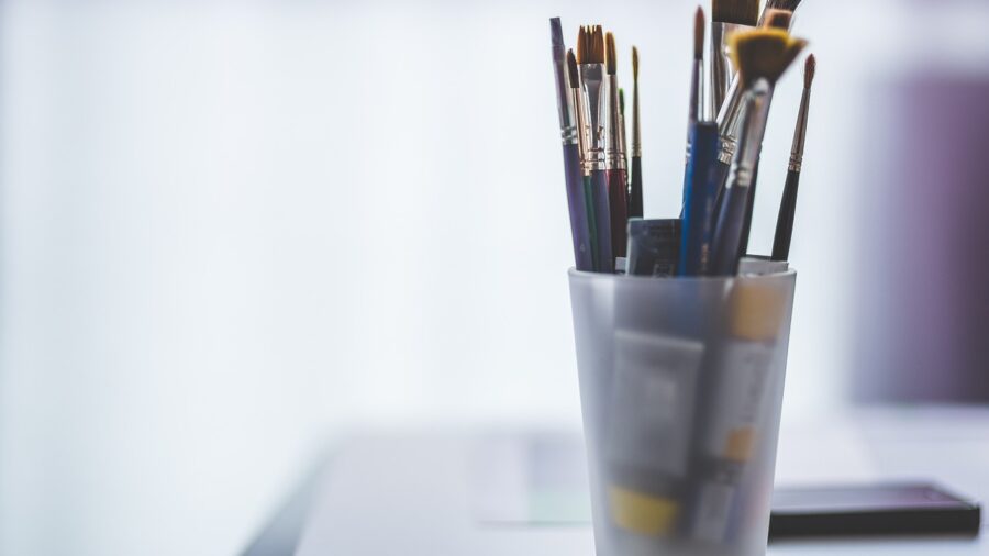 hand-painted credenza and art studio workspace