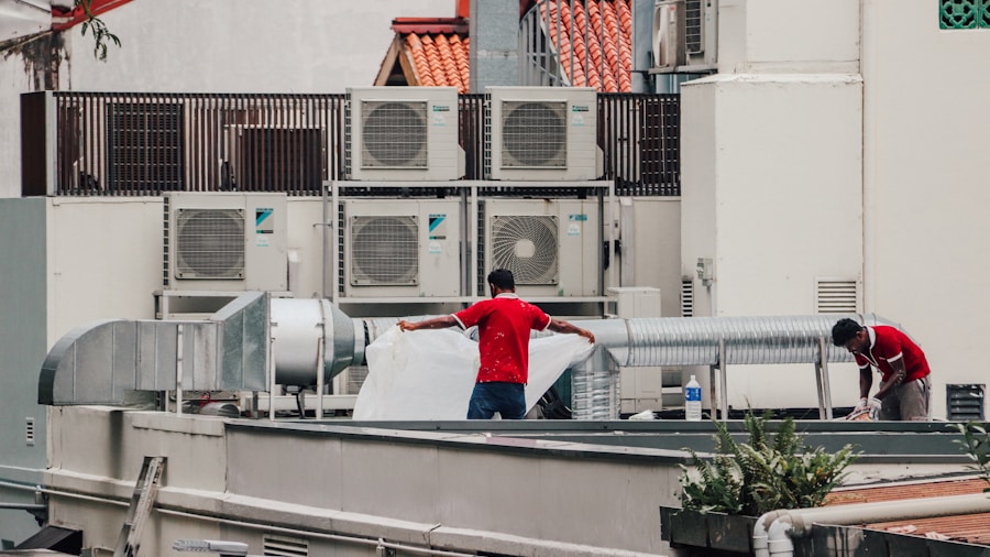 Home Depot Subsidiary Acquires Carrier HVAC Distributor: What Shoppers Need to Know 2 HVAC service technician maintenance work
