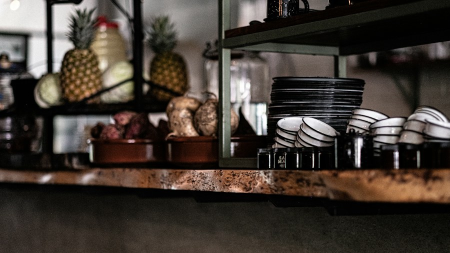IKEA KOLBJÖRN Shelf Gains Buzz After Celebrity Endorsement: What Shoppers Need to Know 1 industrial shelving with dishes glassware