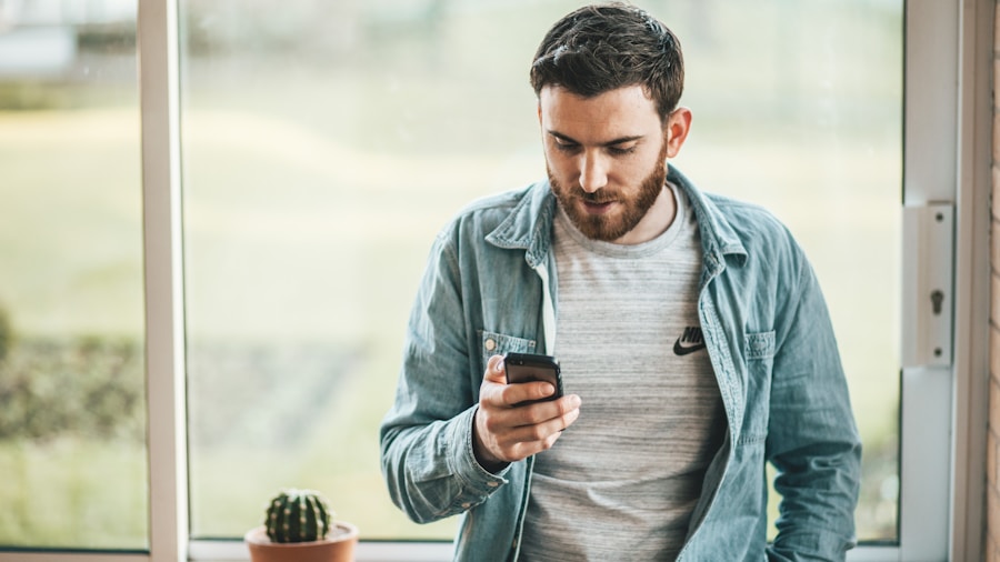 person checking phone home security app