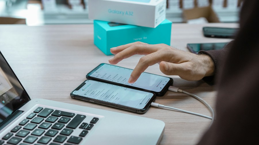 person using smartphone to control speakers