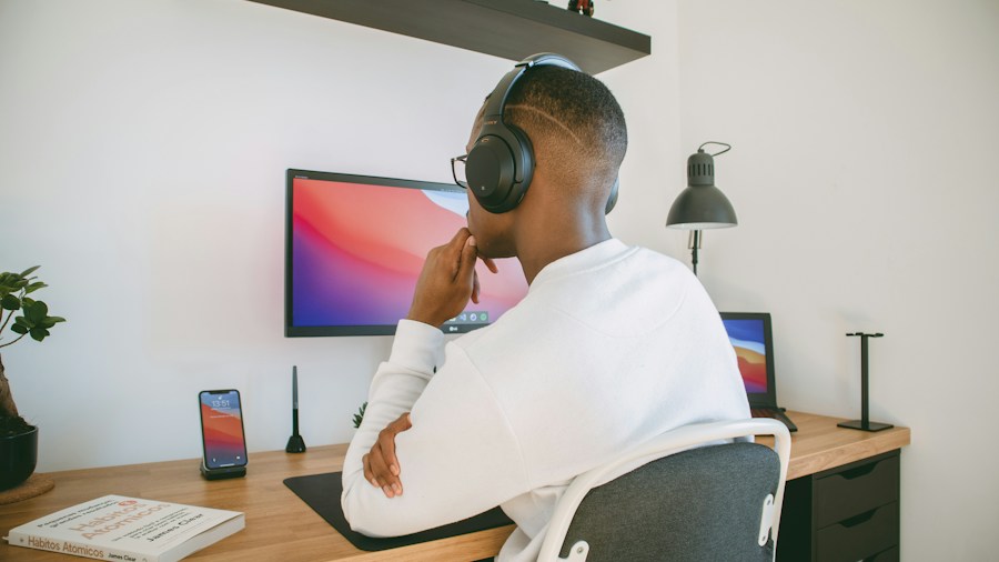 person wearing gaming headset at desk
