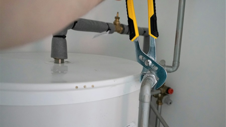 plumber using adjustable tool fitting