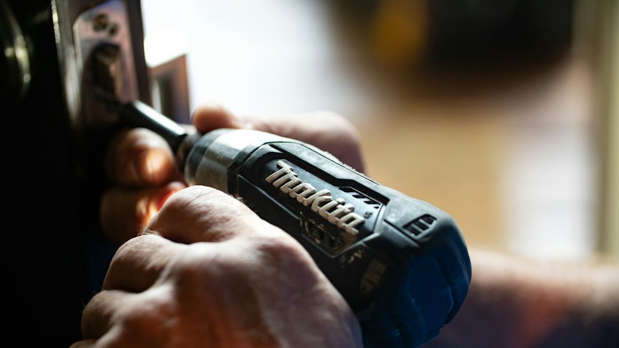 professional mechanic using impact driver fasteners