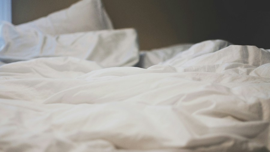 soft pillows and sheets on bed