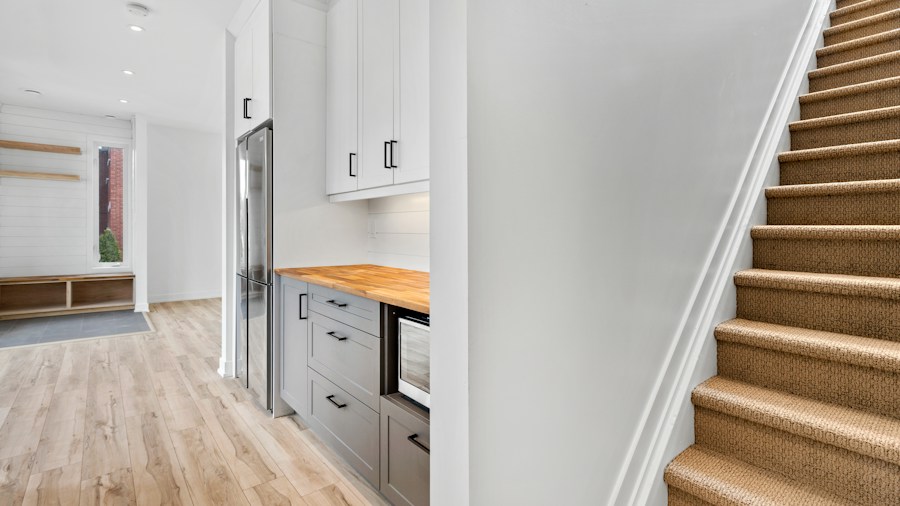 Tiny Home Design Innovation Shows How Multifunctional Seating Is Reshaping Small Space Living 2 stepped platform storage design