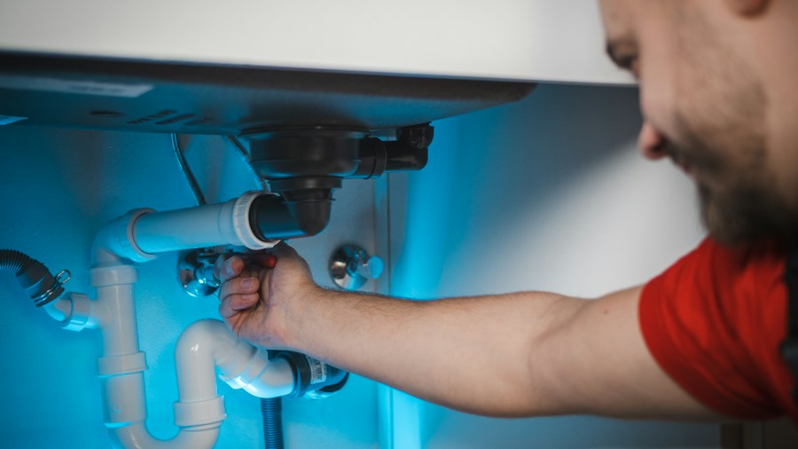 7 Tips to Insulate Your Heat Pump Pipes and Maximize Efficiency 2 technician checking pipe installation