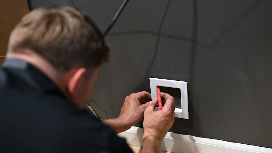 technician installing smart home device