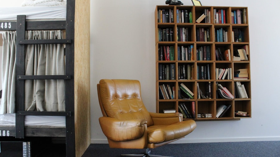 vintage leather armchair by bookshelf