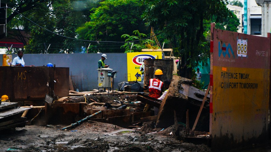 worker in muddy construction site